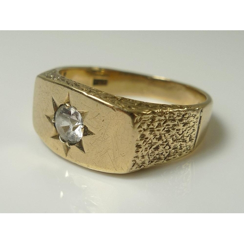 814 - A gentleman's 9ct gold ring set with white stone, likely moissanite or sapphire, size U, 6g.