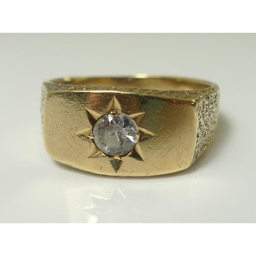 814 - A gentleman's 9ct gold ring set with white stone, likely moissanite or sapphire, size U, 6g.