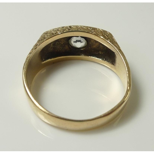 814 - A gentleman's 9ct gold ring set with white stone, likely moissanite or sapphire, size U, 6g.