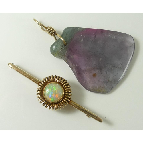 835 - A 14ct gold bar brooch set with an opal surrounded by gold spring halo, opal 0.9mm diameter, marked ... 