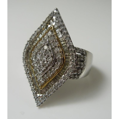 853 - A diamond dress ring, the marquise shaped design set with rows of pave set point and baguette diamon... 