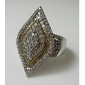 A diamond dress ring, the marquise shaped design set with rows of pave set point and baguette diamon... 