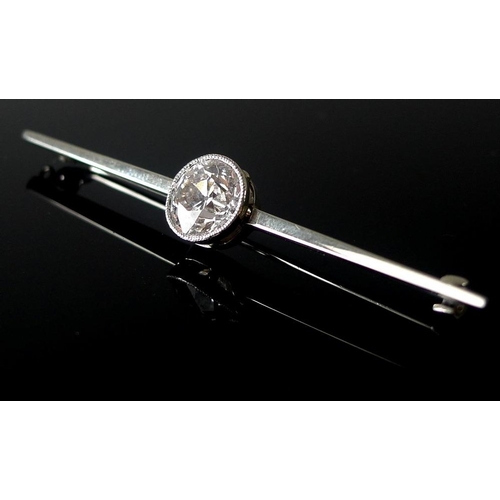 860 - A platinum, 18ct white gold and diamond bar brooch, the exceptionally clear and white solitaire diam... 