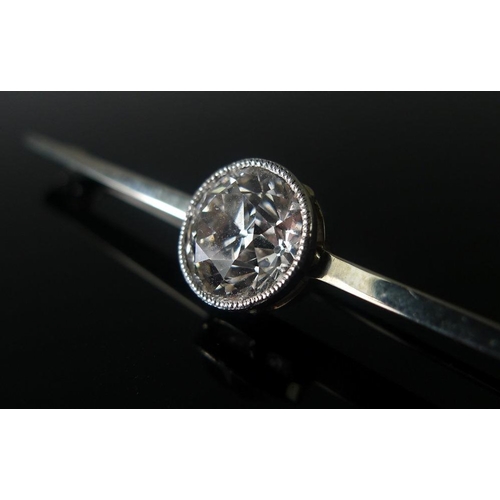 860 - A platinum, 18ct white gold and diamond bar brooch, the exceptionally clear and white solitaire diam... 