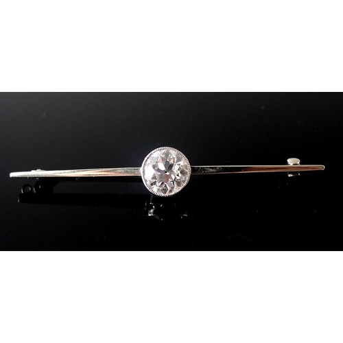 860 - A platinum, 18ct white gold and diamond bar brooch, the exceptionally clear and white solitaire diam... 