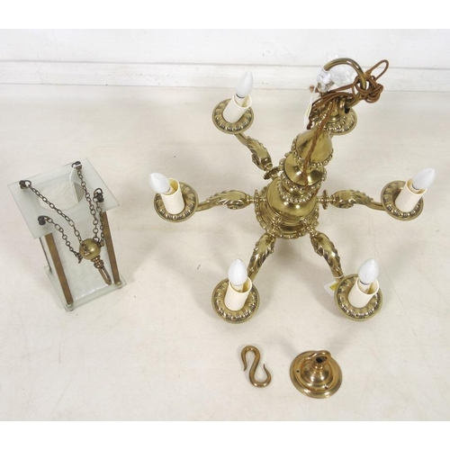 863 - A 19th century five brass candelabra with scroll arms and an acorn terminal, 58cm high, together wit... 