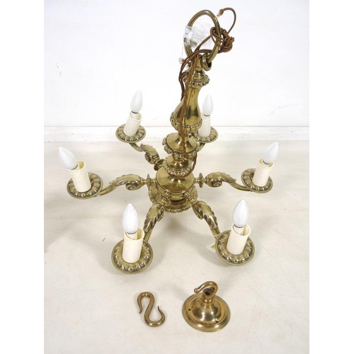 863 - A 19th century five brass candelabra with scroll arms and an acorn terminal, 58cm high, together wit... 