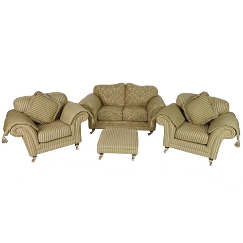 868 - A modern three piece suite, comprising two seater sofa, two armchairs and footstool, the sofa with g... 