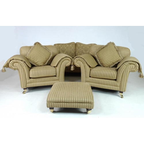 868 - A modern three piece suite, comprising two seater sofa, two armchairs and footstool, the sofa with g... 