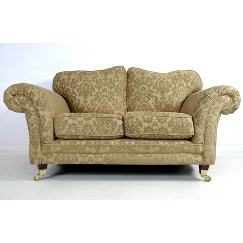 868 - A modern three piece suite, comprising two seater sofa, two armchairs and footstool, the sofa with g... 