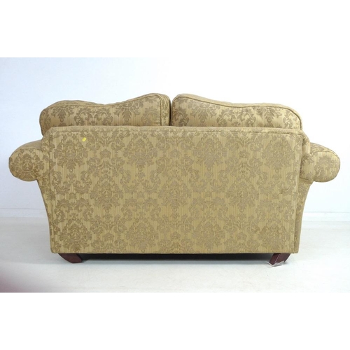 868 - A modern three piece suite, comprising two seater sofa, two armchairs and footstool, the sofa with g... 