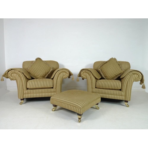 868 - A modern three piece suite, comprising two seater sofa, two armchairs and footstool, the sofa with g... 