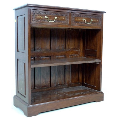 875 - A modern Indian hardwood bookcase with two drawers, floral carved in low relief and inlaid with bras... 