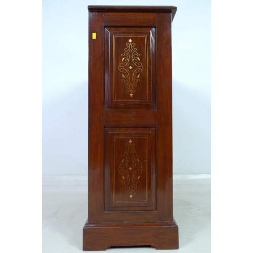 875 - A modern Indian hardwood bookcase with two drawers, floral carved in low relief and inlaid with bras... 