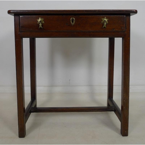 878 - An early 18th century oak side table, single frieze drawer with moulded edges, brass drop handles an... 