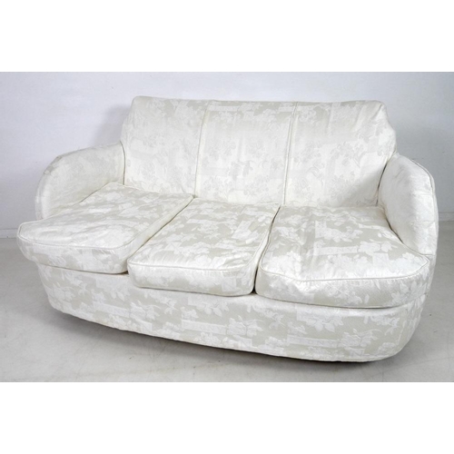 881 - An early to mid twentieth century Art Deco style two seater sofa, with tall stepped curved back, rou... 