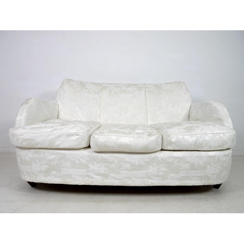 881 - An early to mid twentieth century Art Deco style two seater sofa, with tall stepped curved back, rou... 