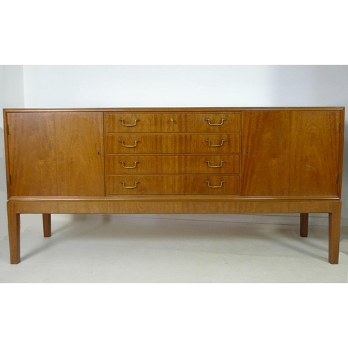 882 - A Danish mahogany sideboard, mid 20th century, by C. B. Hansens, Kopenhagan, four drawers with brass... 