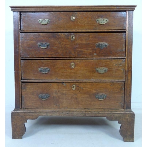 946 - A 17th century oak chest of four graduating drawers, the surface with moulded edges, the sides with ... 