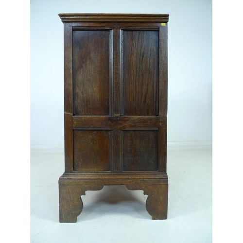 946 - A 17th century oak chest of four graduating drawers, the surface with moulded edges, the sides with ... 