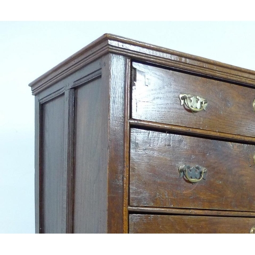 946 - A 17th century oak chest of four graduating drawers, the surface with moulded edges, the sides with ... 