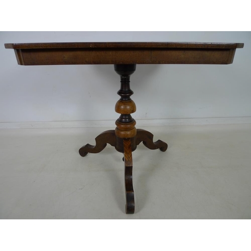 947 - An Italian marquetry tilt top table, Sorrento circa 1860, the rectangular surface with canted corner... 