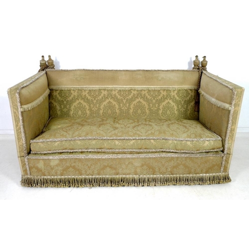 948 - A Knowle settee, circa 1920, upholstered in gold coloured brocade with fringing to the back, sprung ... 