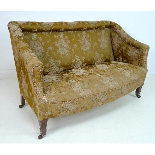 955 - A Victorian two seater settee, with bolster top rail and shaped arms, bowed front and overstuffed se... 