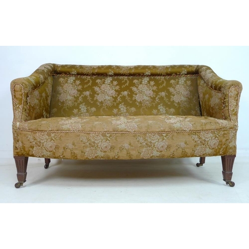 955 - A Victorian two seater settee, with bolster top rail and shaped arms, bowed front and overstuffed se... 