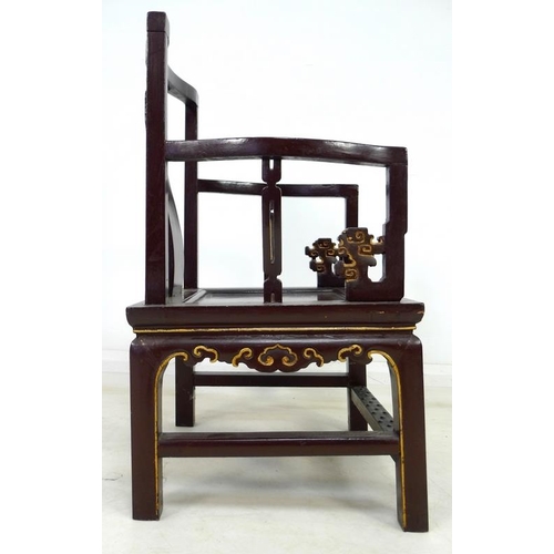 957 - A pair of Chinese hardwood low back open armchairs, Qing Dynasty, late 19th century, painted dark br... 