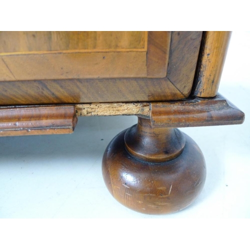 959 - A Queen Anne walnut chest of drawers, circa 1710, crossbanded, inlaid with stringing and feather ban... 