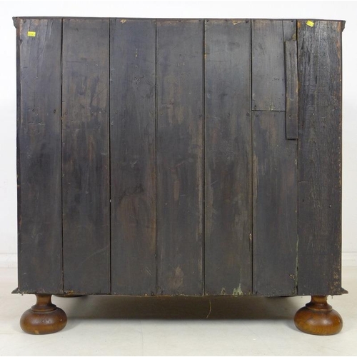 959 - A Queen Anne walnut chest of drawers, circa 1710, crossbanded, inlaid with stringing and feather ban... 