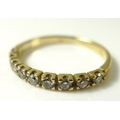 An 18ct gold half eternity diamond ring, 0.32 total diamond weight, size L, 1.8g, with original rece... 