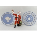 A Royal Doulton figure of Santa Claus, number HN2725, 17 by 25.5cm, together with a Wedgwood Jasperw... 