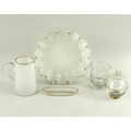 A Victorian translucent milk glass jug and similar dish, gilded detailing, smoothed pontil marks to ... 