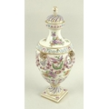 A 19th century porcelain urn with cover, the body painted with floral sprays, birds, swags and gildi... 