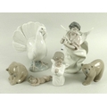 A group of six Lladro figures, comprising two bears, 12 by 10.5cm and smaller, a fantail dove, 20cm,... 
