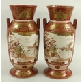 A pair of Japanese Satsuma vases, 19th century, each with two reserves one depicting two workman, wi... 