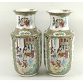 A pair of Canton porcelain vases, Qing Dynasty, late 19th century, typically decorated with reserves... 