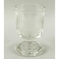 An early 19th century glass rummer, with unusually thick pedestal base, likely a toasting glass, the... 