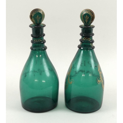 501 - A pair of George III mallet form green glass decanters and stoppers, three trailed rings to the neck... 