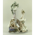 A large Lladro figural group entitled Ballet Trio, modelled with three young female dancers around a... 