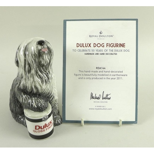 506 - A collection of ceramics, comprising a Royal Doulton figurine modelled after the Dulux Dog, 'Celebra... 