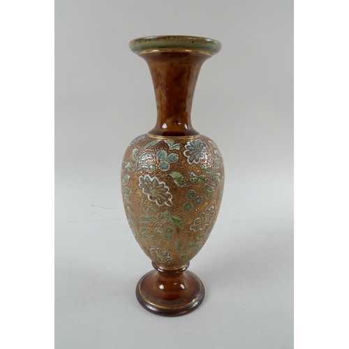 512 - A Royal Doulton vase of baluster form, the body textured with floral lace design over-painted with g... 