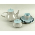 A Poole Pottery part dinner service in dove grey and bleu celeste, circa 1970, comprising six dinner... 