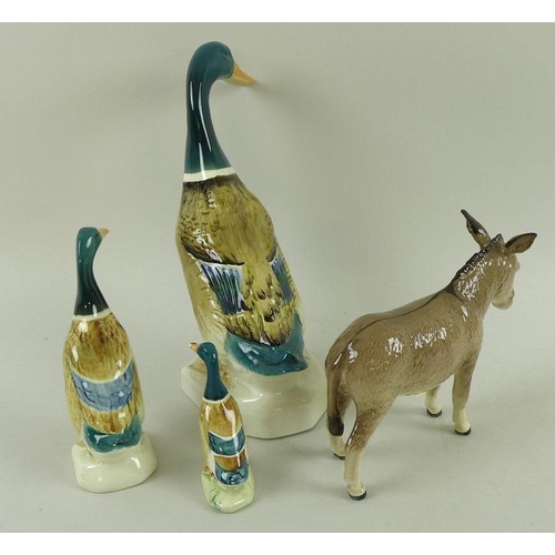 529 - A group of three Beswick figurines, modelled as mallard ducks, the larger, model 902, impressed mark... 