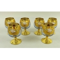 A set of six Venetian blue glass wine goblets, mid 20th century, decorated with impasto flowers on a... 