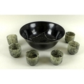 A set of six jade rice wine cups, grey with black specks, each 5 by 5cm, together with a dark mottle... 