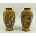 A pair of late 19th or early 20th century Satsuma vases, each painted with sages and a dragon weavin... 