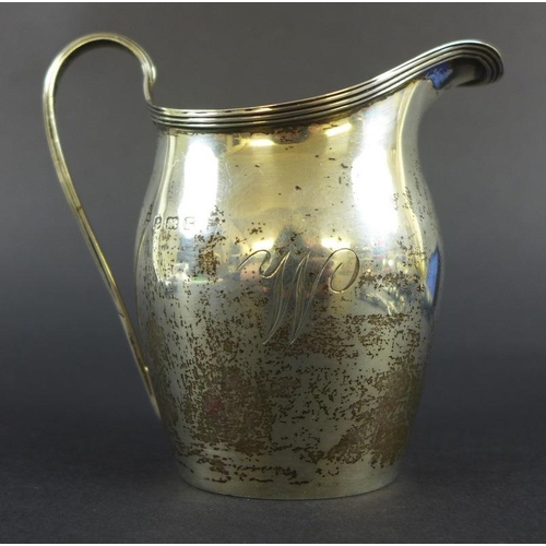 758 - A collection of George III and later silver items including a cream jug with reeded upper rim and ha... 